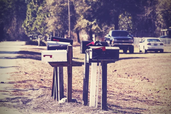 Vintage picture of mail boxes, rural area, USA. — Stock Photo, Image