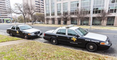 State troopers cars parked in University of Texas. clipart