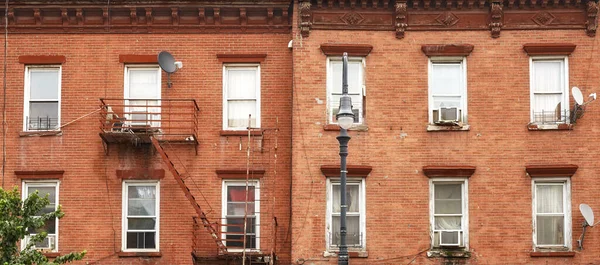 Old brick townhouses in New York City, USA.