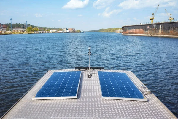 Photovoltaic panels installed on a boat roof.