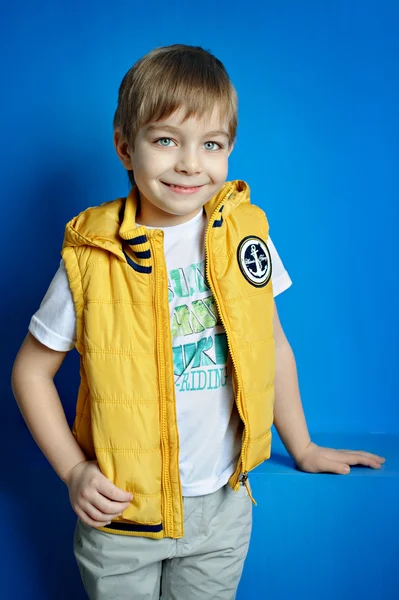 Little boy in a yellow vest — Stock Photo, Image