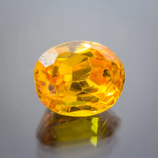 Natural Sapphire gemstone, Jewel or gems on black shine color, natural yellow gemstones on stone
