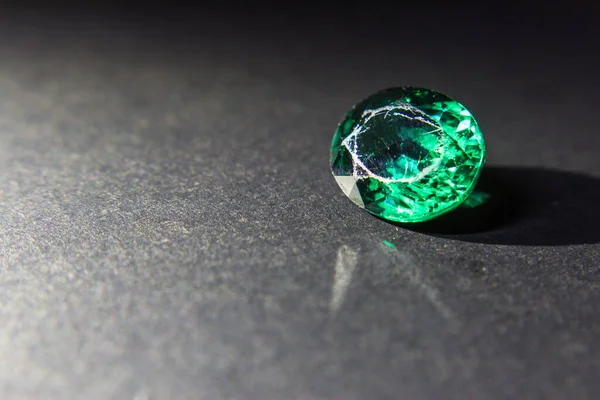 Natural Green Sapphire gemstone. Beautiful green gemstone gemstone isolated on a black background, as jewelry background