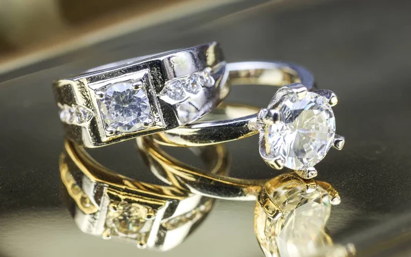 Close up of engagement diamond rings. Love and wedding concept.