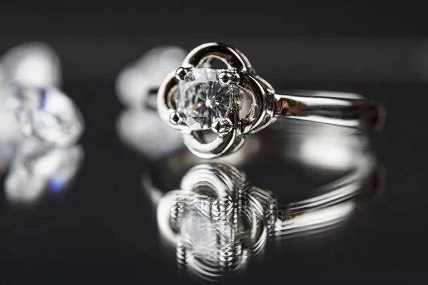 Close up of engagement diamond ring. Love and wedding concept.