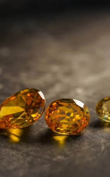 close up of natural yellow mineral gemstones, studio shot