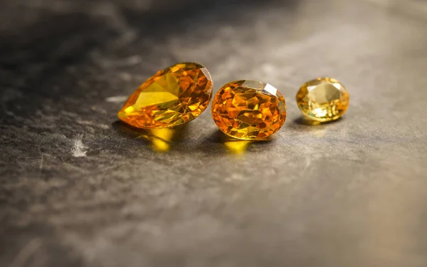 close up of natural yellow mineral gemstones, studio shot