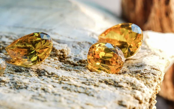 natural yellow mineral gemstones on stone