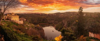 Panoramic at sunset on the Tagus river of the medieval city of Toledo in Castilla La Mancha, Spain