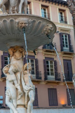 Water fountain in the Plaza de la Constitucion in the city of Malaga, Andalusia. Spain