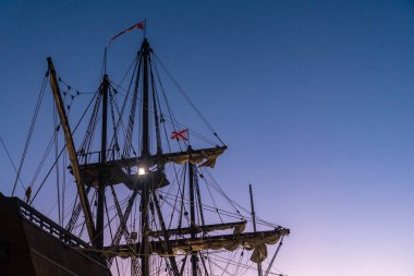 Detail of the old ship at sunset on the promenade of Muelle Uno in the Malagaport of the city of Malaga, Andalusia. Spain