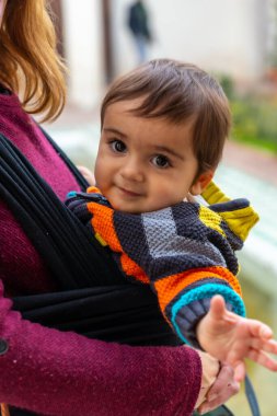 Child visiting the courtyard with water fountains inside the Alcazaba in the city of Malaga, Andalusia. Spain. Medieval fortress in arabic style