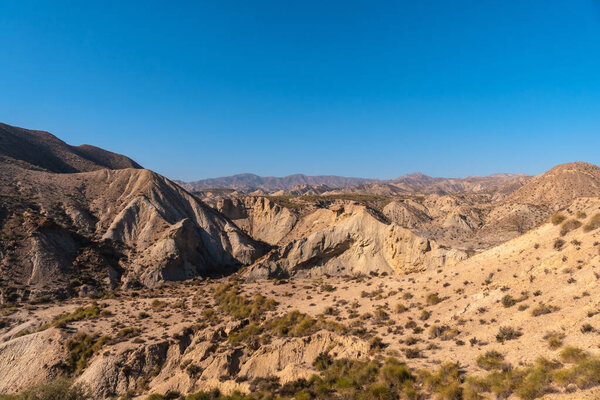 Precious curve in the path of the desert canyon of Tabernas, province of Almeria, Andalusia. On a trek in the Rambla del Infierno