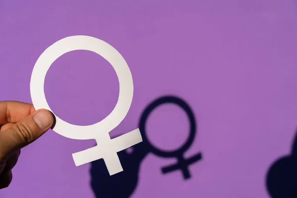 Woman Holding Female Symbol Purple Background Her Beautiful Shadow Seen — Stock Photo, Image