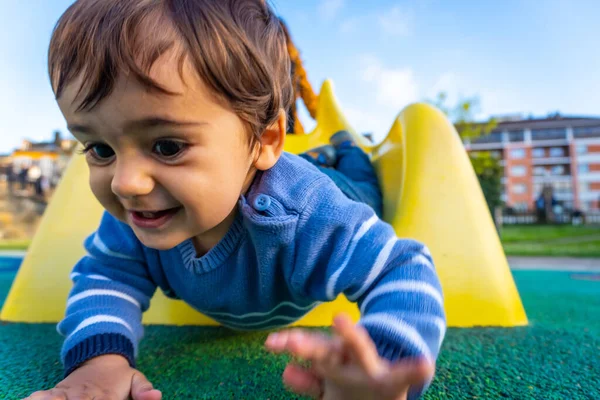 One Year Old Caucasian Boy Smiling Playing Swings Playing Park — стоковое фото