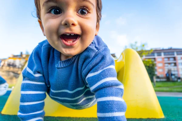 One Year Old Caucasian Boy Smiling Playing Swings Playing Park — стоковое фото