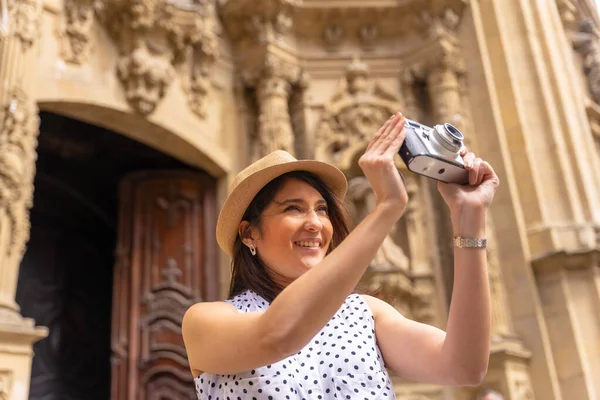 Tourist Woman Smiling Hat Visiting Church Taking Photos Camera Enjoying — Stock Fotó