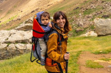 A young man on the trail arriving at the Refugio dero Berde in the Ripera Valley, Pyrenees