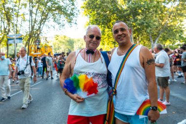 Madrid, Spain: July 9, 2022: An older adult couple enjoying the gay pride party, lgbt in Madrid
