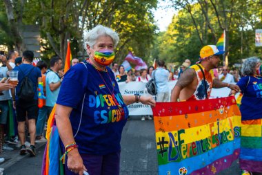 Madrid, Spain: July 9, 2022: Lesbian elderly women at the gay pride parade party, lgbt in Madrid
