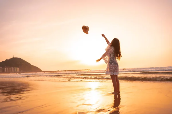 Woman Sunset White Dress Sea Summer Throwing Hat Vacation —  Fotos de Stock