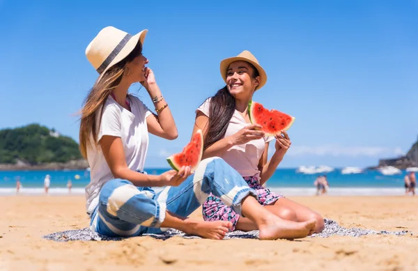 Two Sisters Summer Beach Eating Watermelon Enjoying Holidays Sea Background — стоковое фото