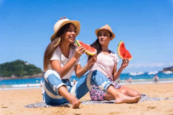 Two Sisters Summer Beach Eating Watermelon Vacation Sea Background — стоковое фото