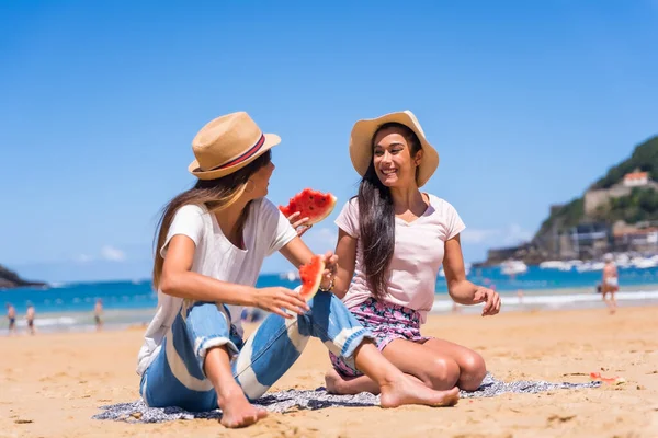 Two Friends Summer Beach Smiling Eating Watermelon Sea Background Wearing — стоковое фото