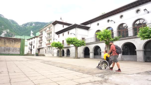 Disabled Person Wheelchair Walking Town Square Friend — Vídeos de Stock