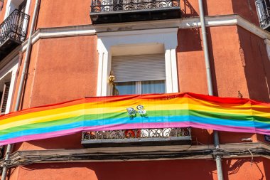 Balconies of the Chueca neighborhood of Madrid adorned with colors of the lgtb rainbow flag