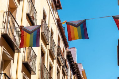 lgbt flags hanging in the streets and balconies at the pride party in madrid