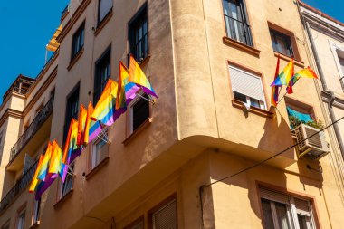 lgbt flags hanging in the streets and balconies at the pride party in madrid