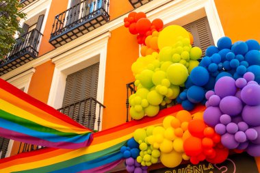 Balloons decorated with the lgbt flag in the streets at the pride party in madrid clipart