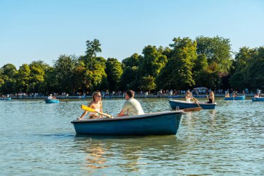 Tourists in the boats of the Estanque Grande de El Retiro in the city of Madrid. Spain