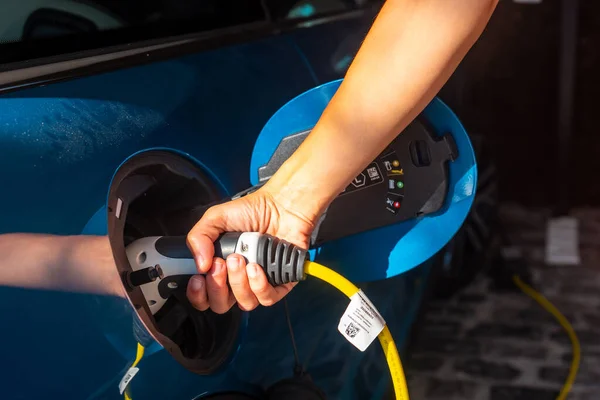 Woman Charging Electric Car Charging Batteries Garage Home Gasoline — Stock Fotó