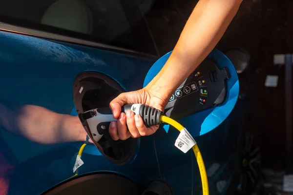 Woman Charging Electric Car Charging Batteries Garage Home Gasoline — Fotografia de Stock