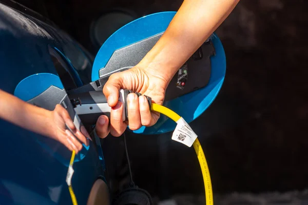 Detail Hand Holding Electric Car Charging Batteries Garage House Gasoline — Fotografia de Stock
