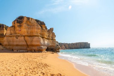 Beautiful beach in summer at sunset at Praia da Coelha, Algarve, Albufeira. Portugal
