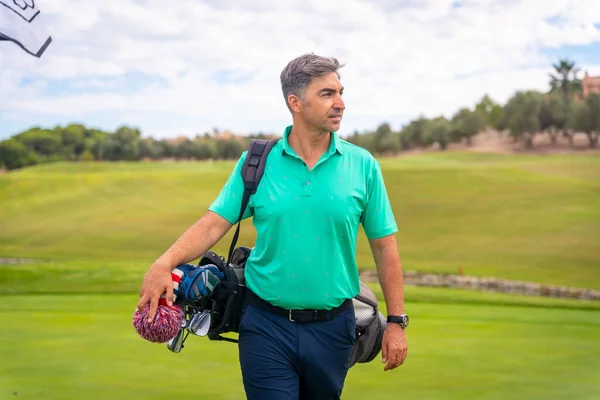 A professional golf player on a golf course