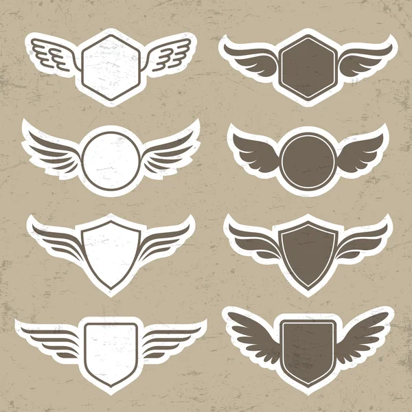 Vintage heraldic shapes with wings — Stock Vector