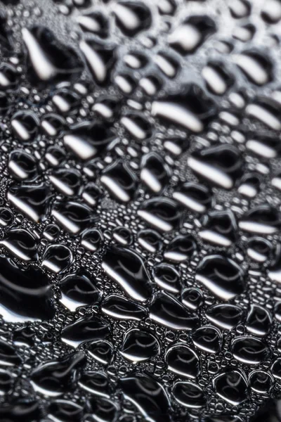 Gotas de agua sobre vidrio negro — Foto de Stock