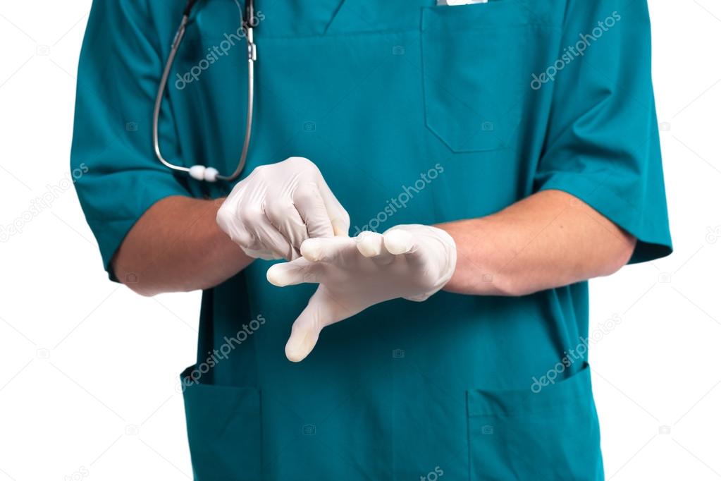 Doctor putting on protective gloves