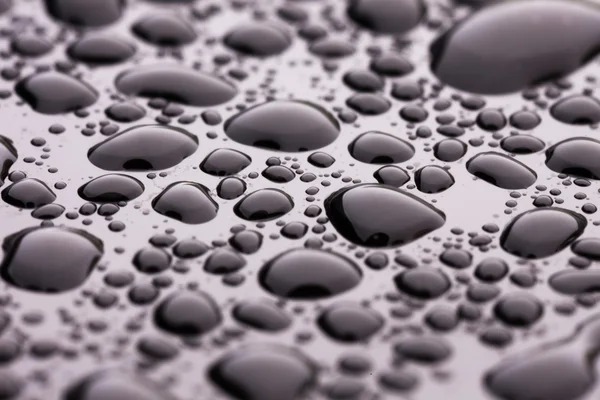 Gotas de agua en negro — Foto de Stock