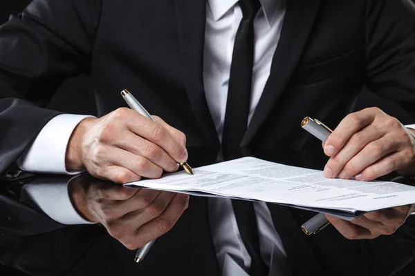 Extreme close up of female business hand signing document. — Stock Photo, Image