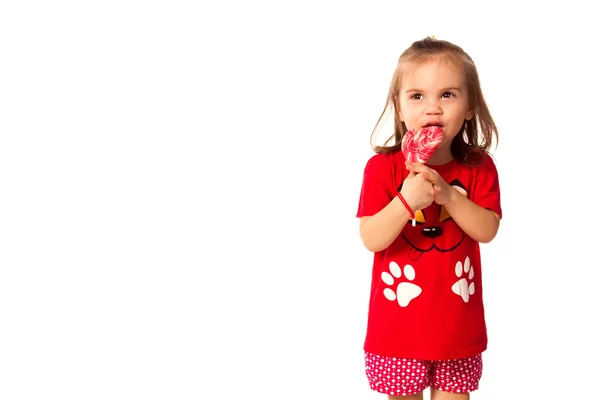 Cute little girl with a lollipop — Stock Photo, Image