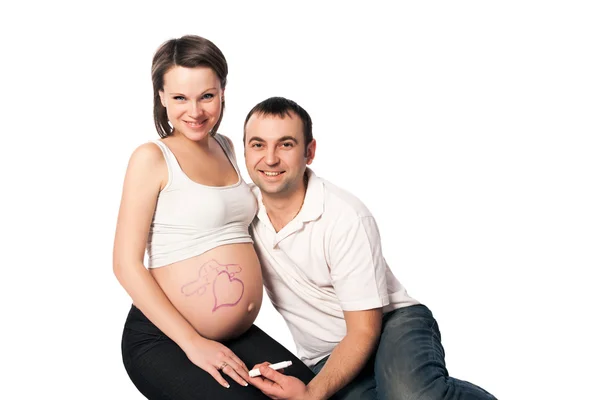 Беременные женщины с нарисованным мужем рисунком на животе — стоковое фото