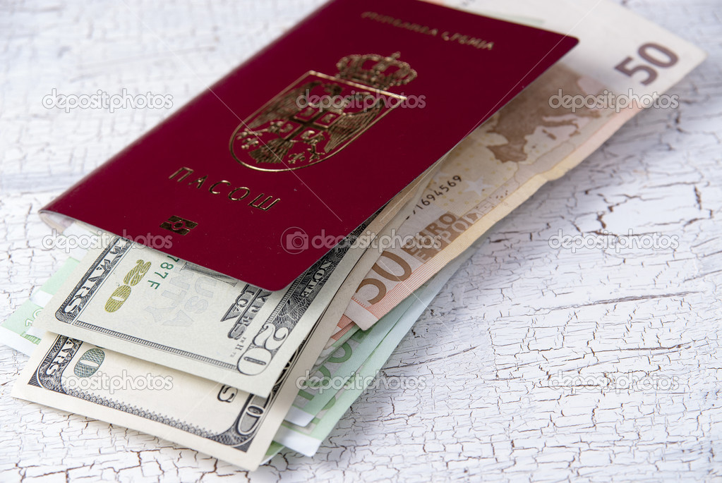 serbian passport and money on table