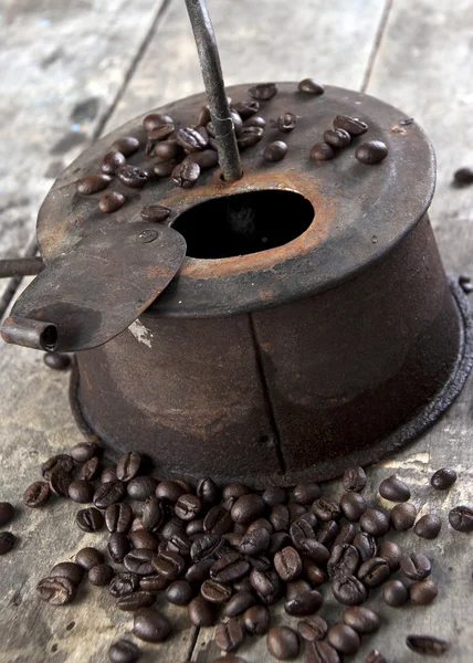 Old coffee roaster on wooden table — Stock Photo, Image