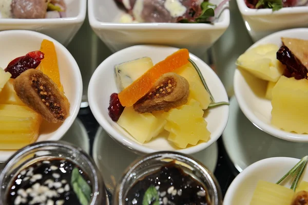 Finger food in small white plates - food catering