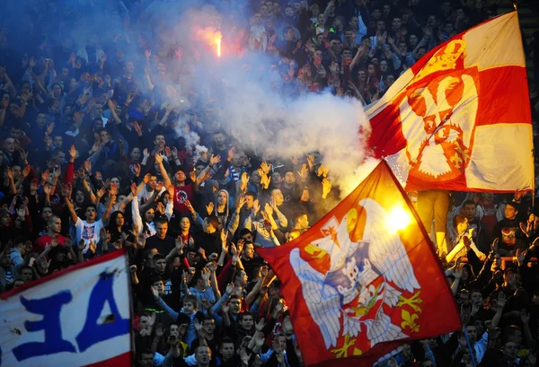 Soccer or football fans using pyrotechnics — Stock Photo, Image
